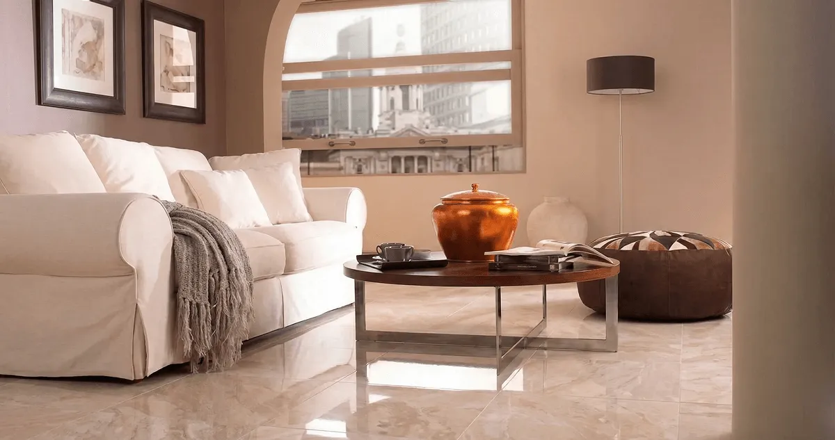 Modern living room with professionally installed marble flooring, a beige sofa, coffee table in Milwaukee, WI
